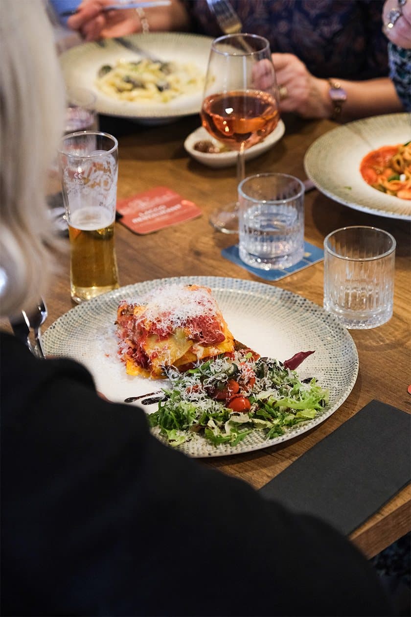 Guests sharing plates across a full table